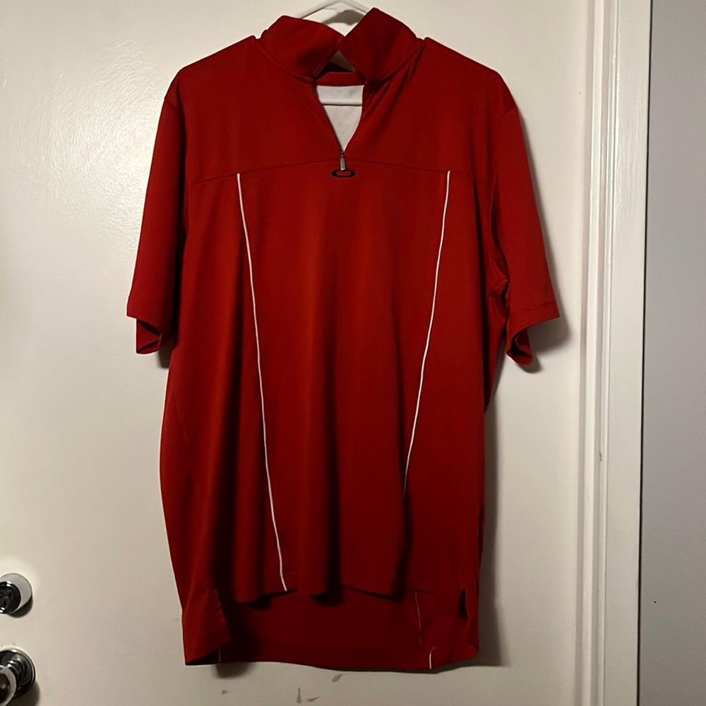 Large in men’s collard shirt, made by Oakley, red and white